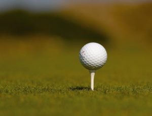Golf ball on a tee | family golf tours Ireland